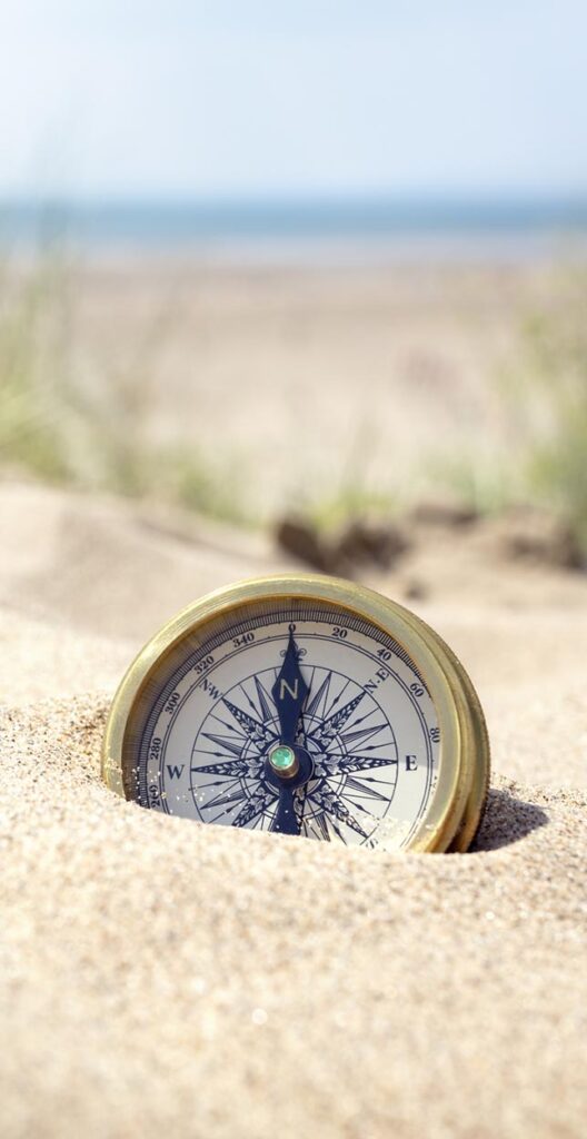 Compass in sand